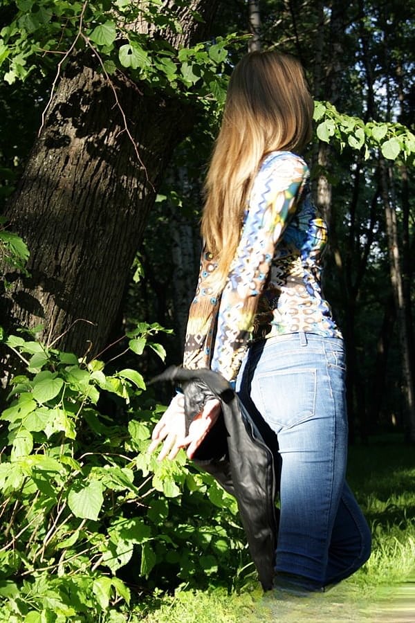 Slim amateur uncovers her small tits in blue jeans during homemade action