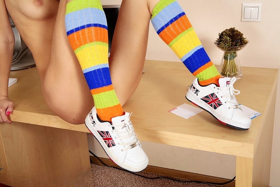 Solo girl Dasha gets naked in multi-colored knee socks and sneakers