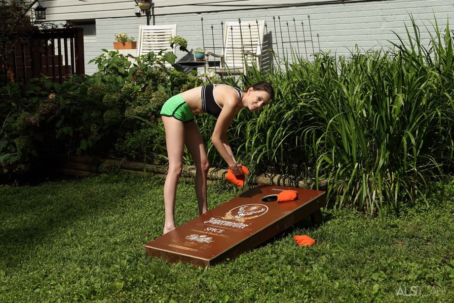 Slender brunette teen Aria Haze dildos her tight pussy atop bean bag toss