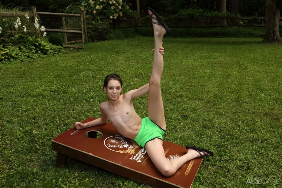 Slender brunette teen Aria Haze dildos her tight pussy atop bean bag toss