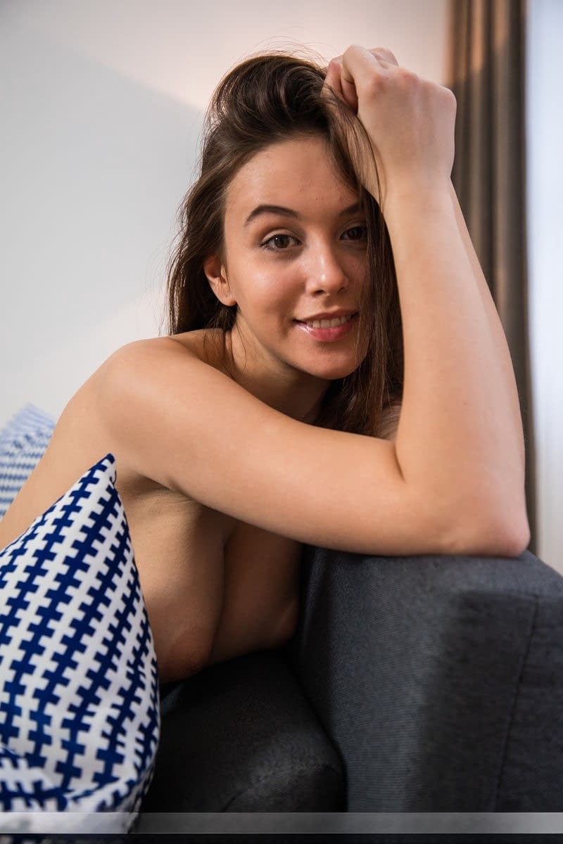 Totally naked teen Alisa I shows off her great body on a living room sofa