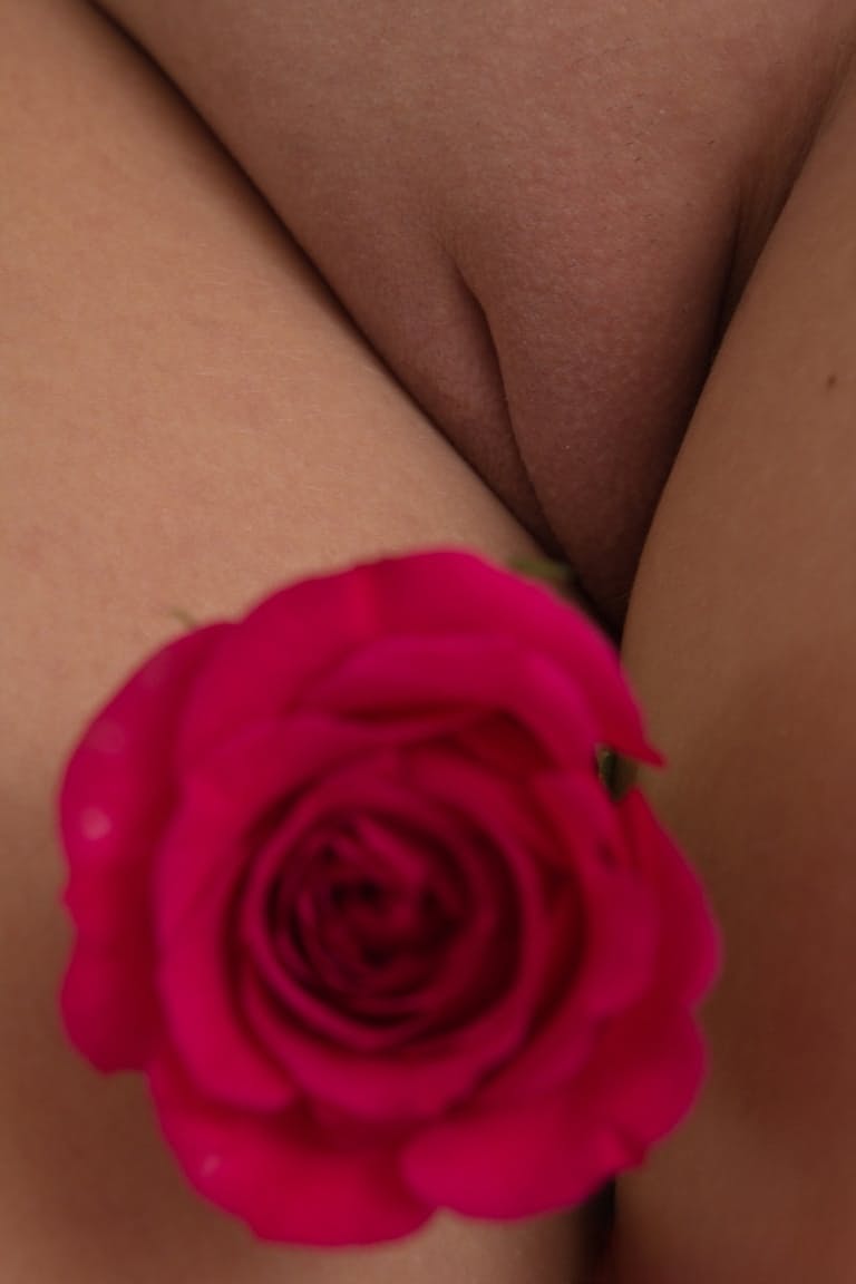 Cute teen Eveline finger fucks her beautiful pussy with legs spread wide open