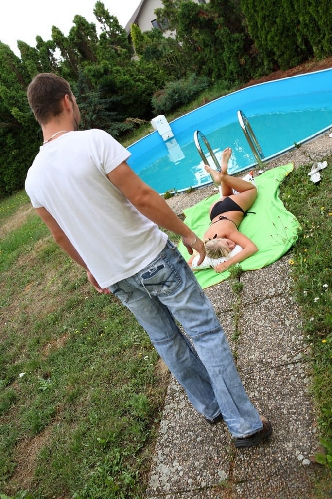 Blonde teen gets cum on her face after fucking next to swimming pool