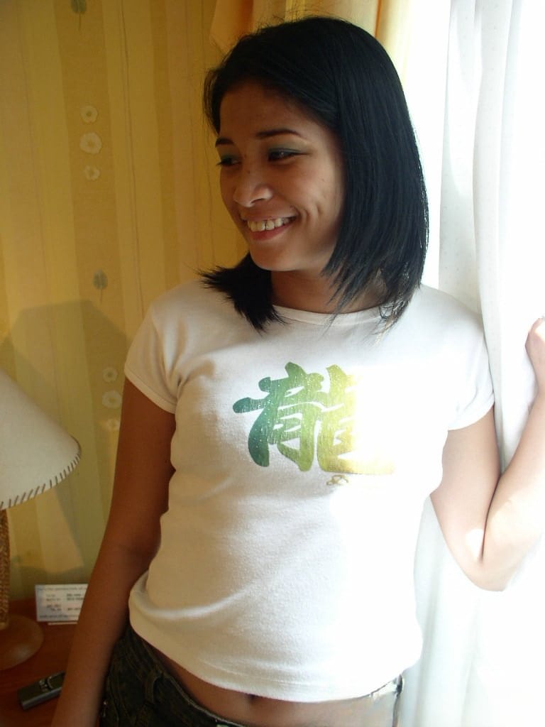 Young looking Asian girls undress on their bed for lesbian sex