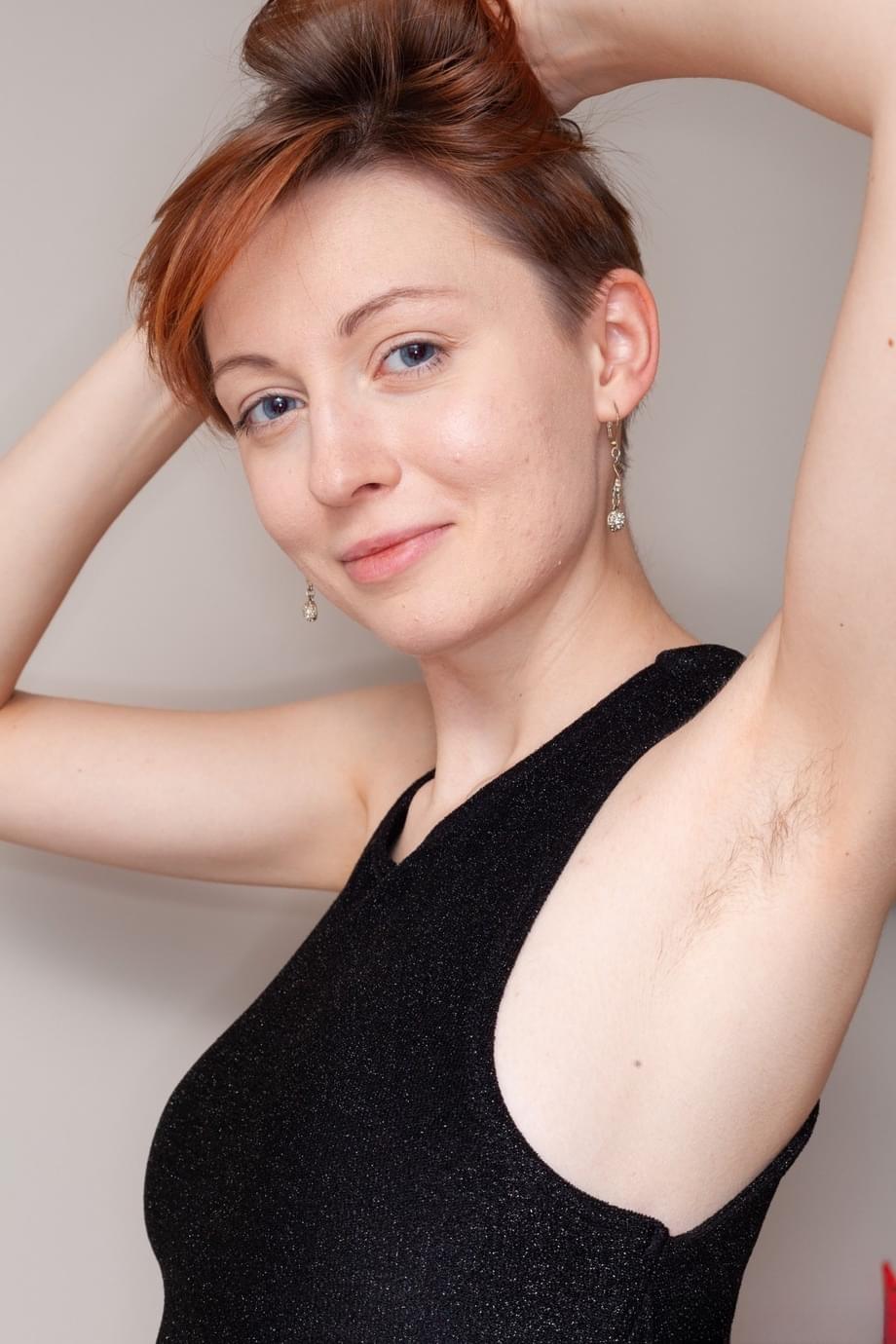 Short haired redhead fingers her bush after baring her firm tits