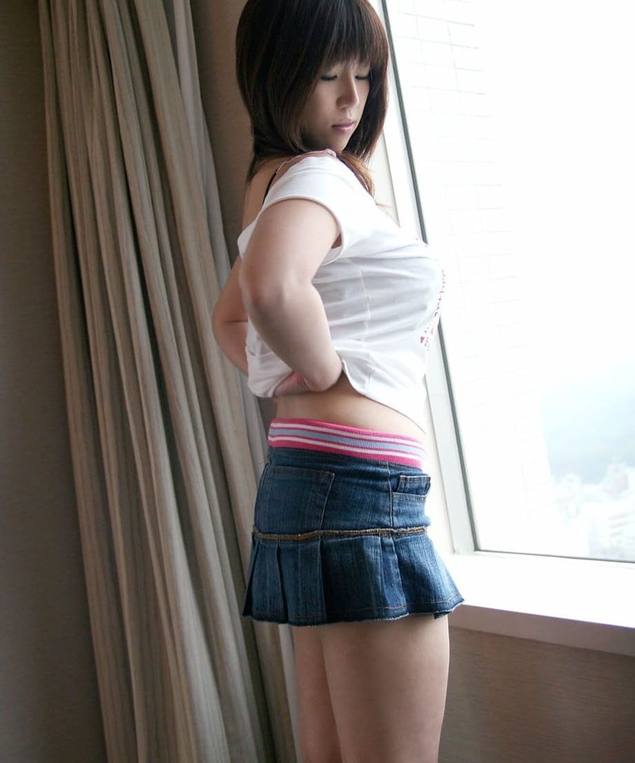 Japanese teen Haduki uncovers her great tits and hairy bush as she disrobes