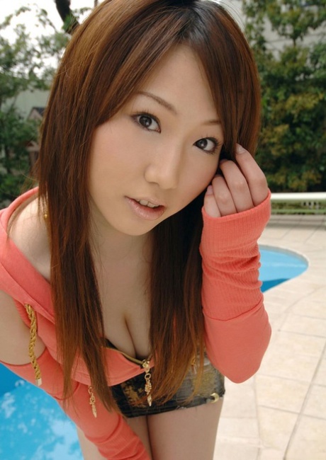 Cute Japanese girl Ai Sayama bares her great tits as she gets naked in kitchen