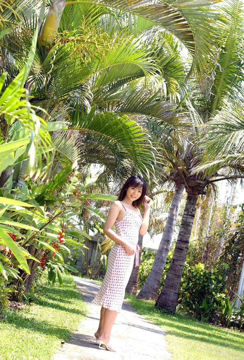 Young looking Japanese girl Saki Ninomiya gets naked with ocean behind her