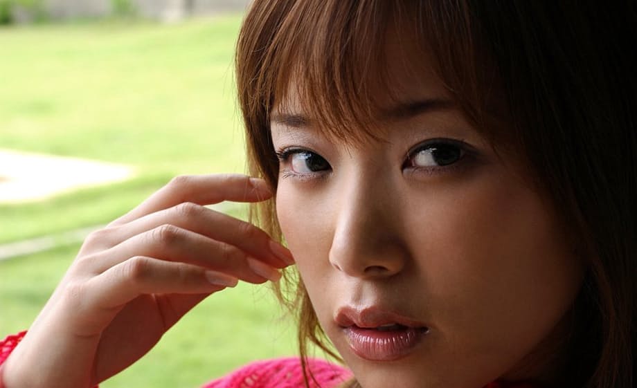 Young Japanese girl exposes her firm breasts and trimmed bush