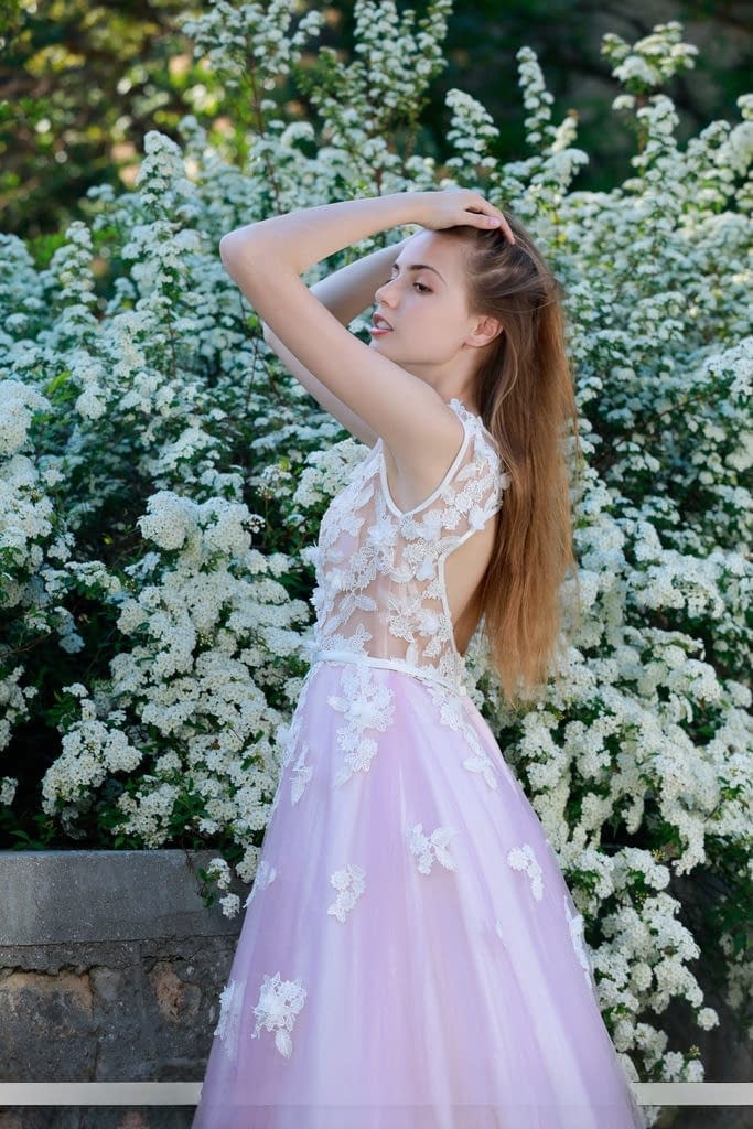 Beautiful girl Elle Tan slips off wedding dress to pose nude in garden
