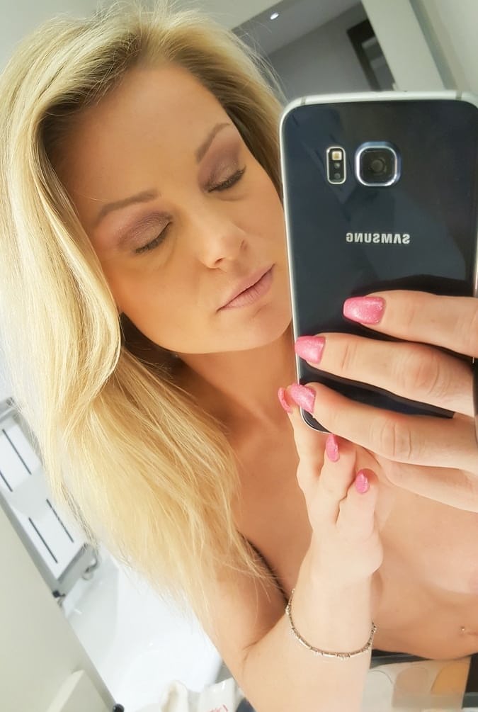 Amateur model takes naked and non naked bathroom selfies in mirror
