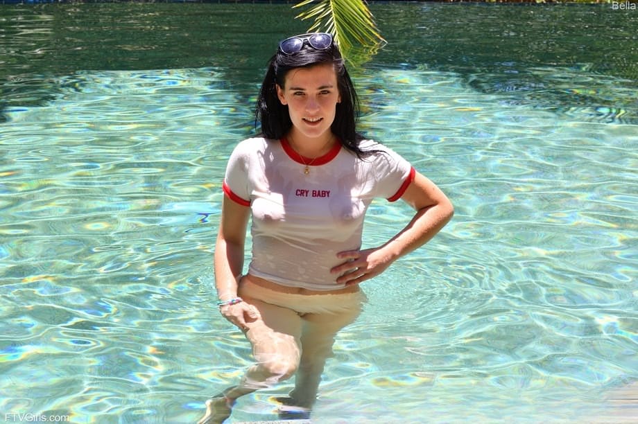 Teen girl with black hair rides a dildo before showing her bare ass in a pool