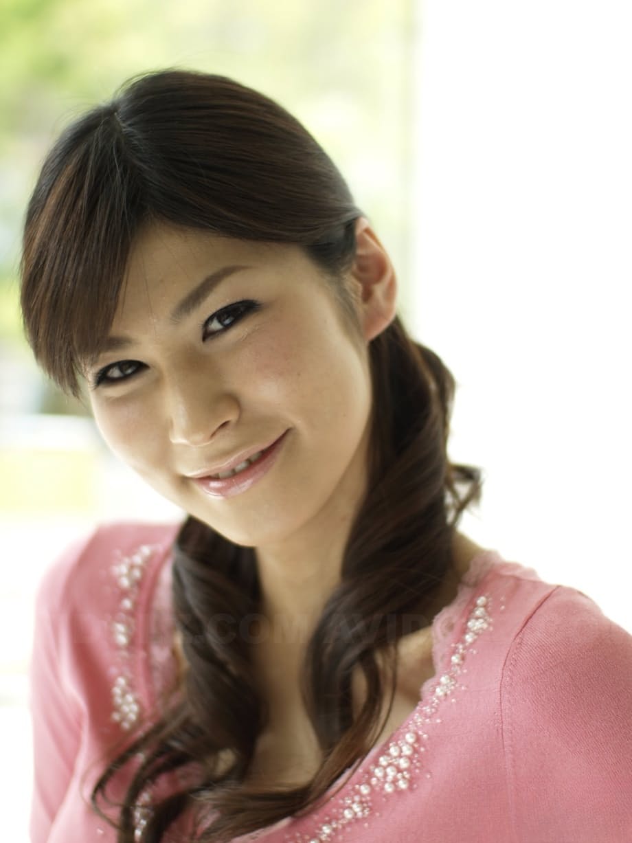 Clothed Japanese model Yuka Yamada shows her bare legs in a skirt