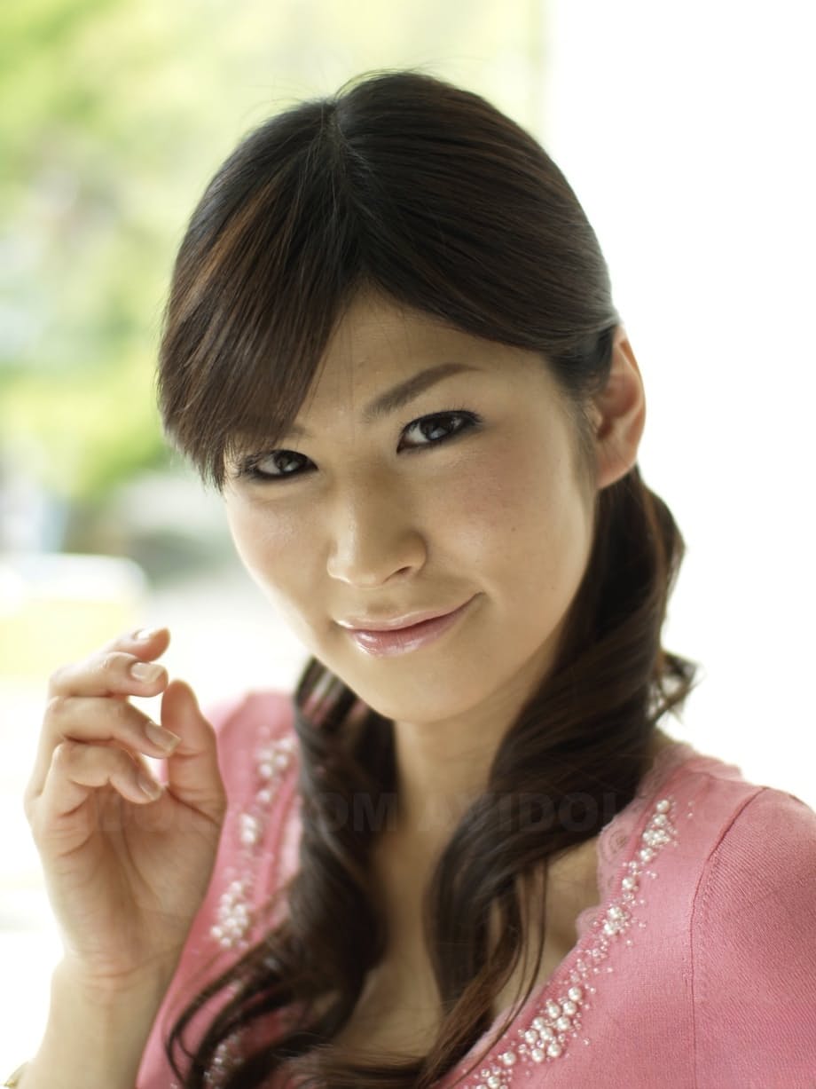 Clothed Japanese model Yuka Yamada shows her bare legs in a skirt