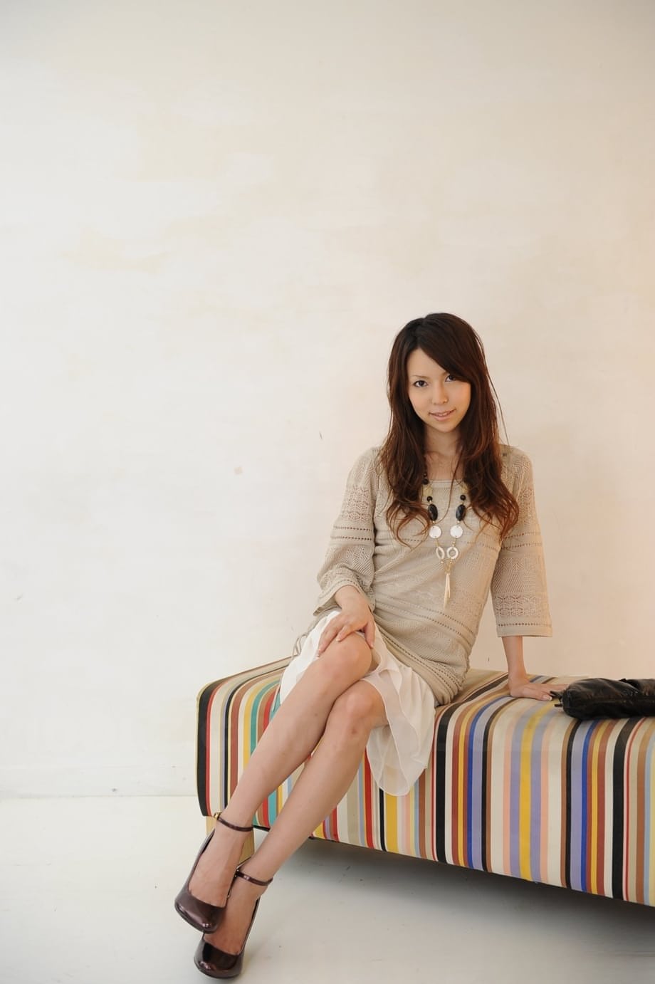 Japanese solo girl Rino Tokiwa models non nude in skirt and ankle strap shoes