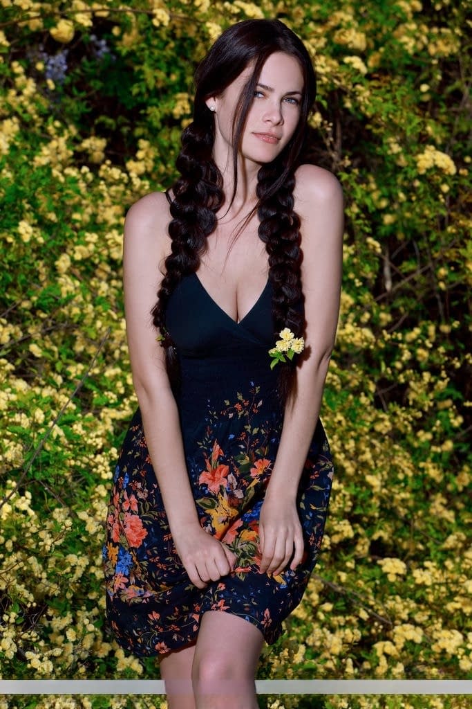 Sexy teen Martina Mink gets undressed in braided pigtails by flowering bushes