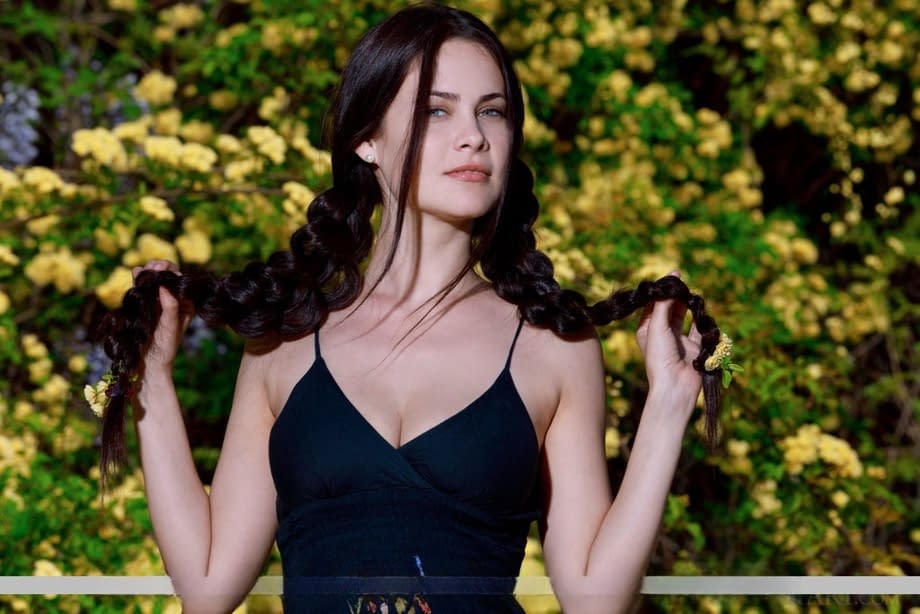 Sexy teen Martina Mink gets undressed in braided pigtails by flowering bushes