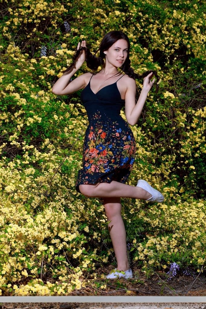Sexy teen Martina Mink gets undressed in braided pigtails by flowering bushes