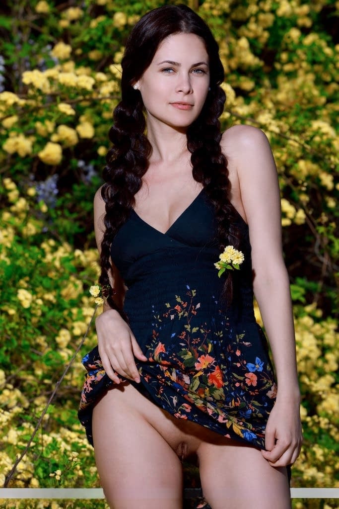 Sexy teen Martina Mink gets undressed in braided pigtails by flowering bushes