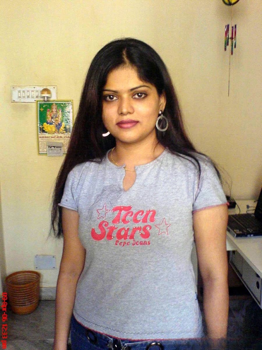 Petite Indian girl uncups big naturals after removing blue jeans