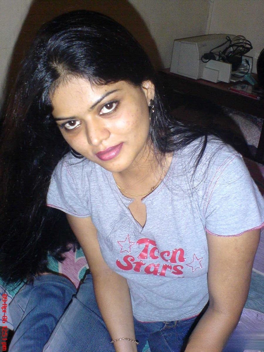 Petite Indian girl uncups big naturals after removing blue jeans