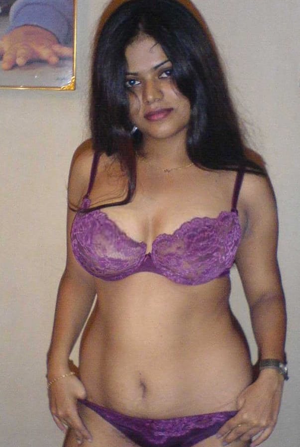 Petite Indian girl uncups big naturals after removing blue jeans
