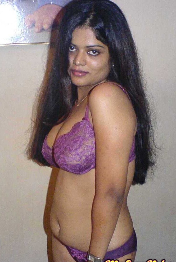 Petite Indian girl uncups big naturals after removing blue jeans