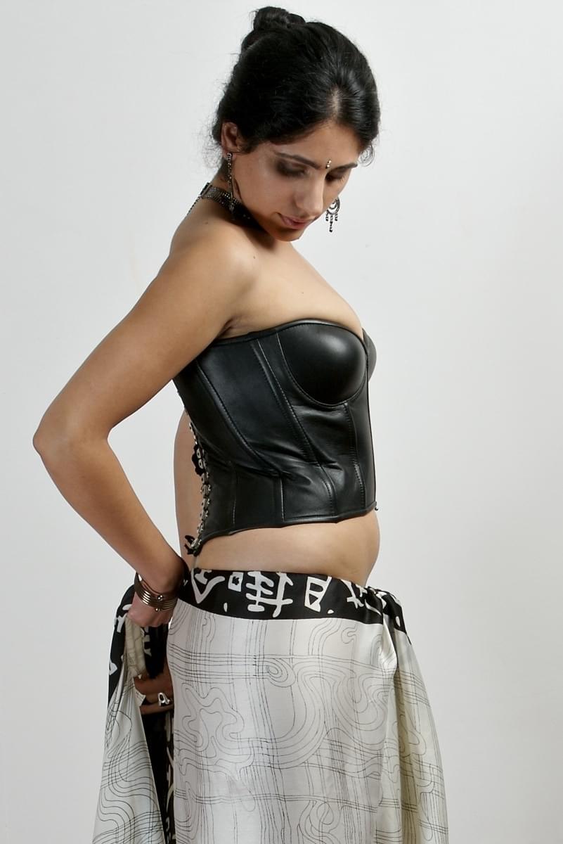Hot Indian girl exposes nice tits and some bush wearing a choker