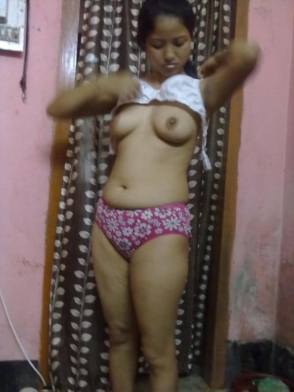 Nepalese girl uncovers natural tits as she disrobes to her panties