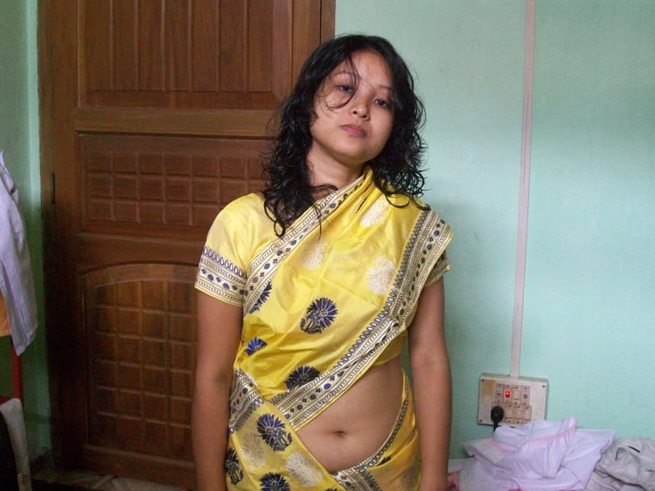 Indian wife changes attire while pleasuring her husband on bed POV style