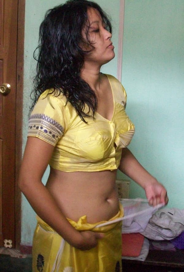 Indian wife changes attire while pleasuring her husband on bed POV style