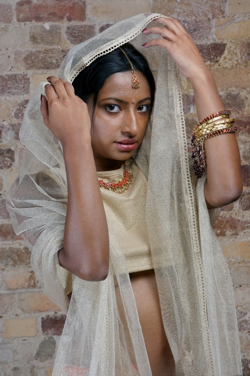Indian model with tattoos exposes her firm tits in traditional clothing