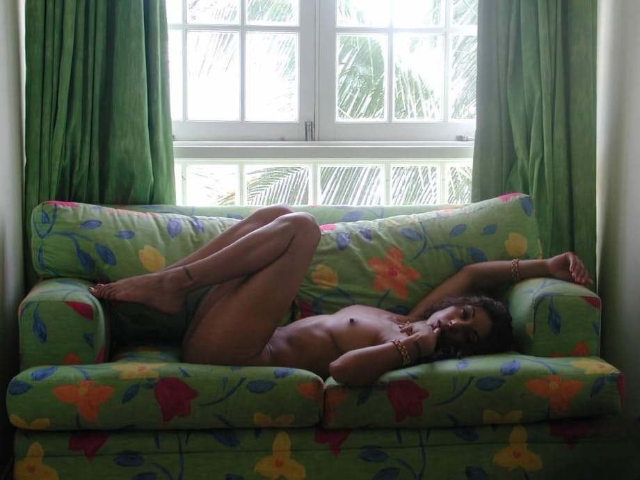 Naked Indian girl showcases her trimmed pussy after lounging on chesterfield