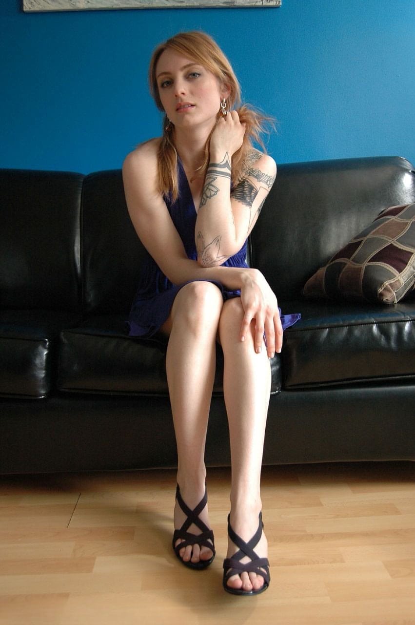 Teen first timer Oro Mali strips naked on black couch in solo action