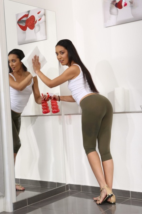 Long haired girl Amanda Estela plays pee games during masturbation session
