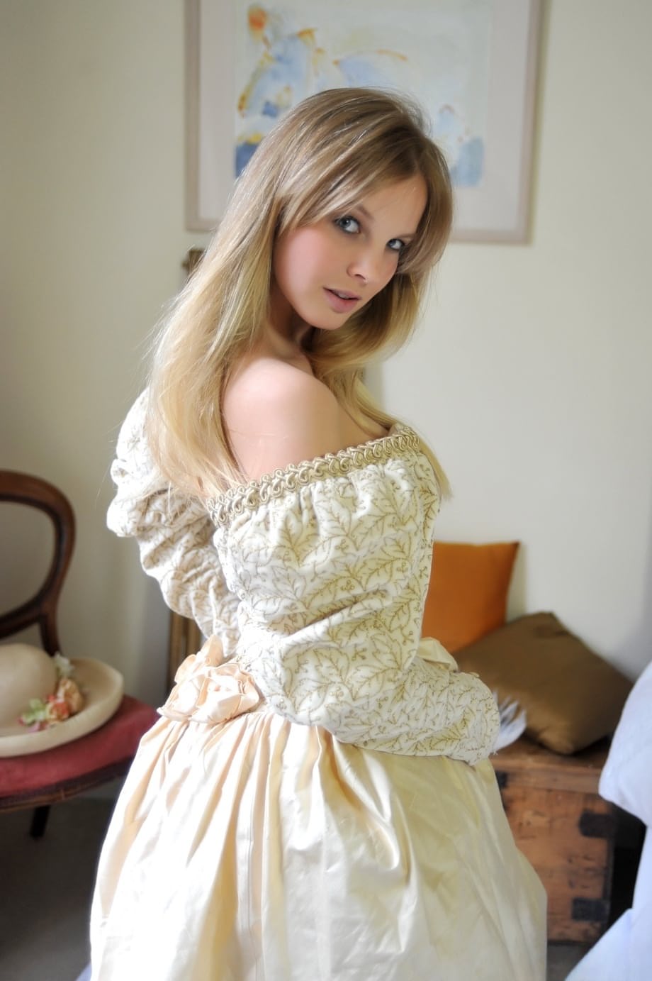 Blonde girl Rose takes off her petticoat to model in a girdle and nylons