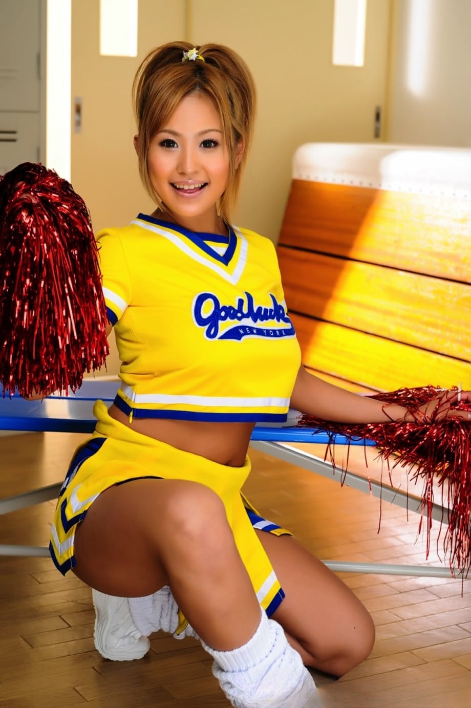 Adorable Japanese cheerleader uncovers great tits before showing her pussy