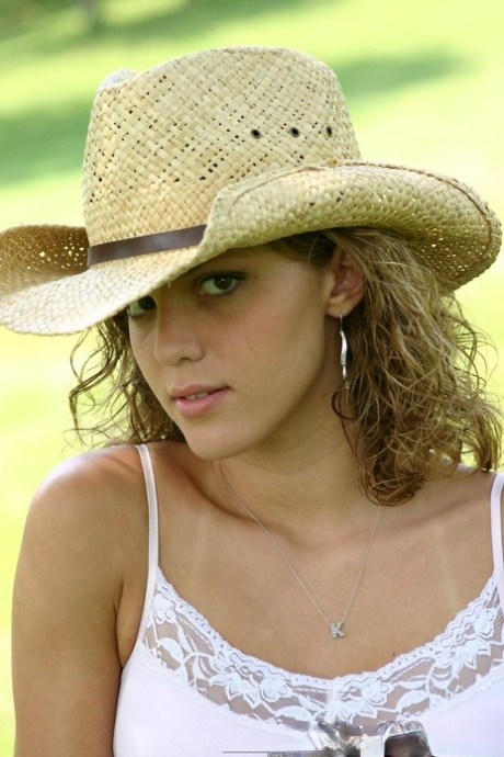 Teen amateur Karen lets denim skirt ride up to expose her underwear in yard