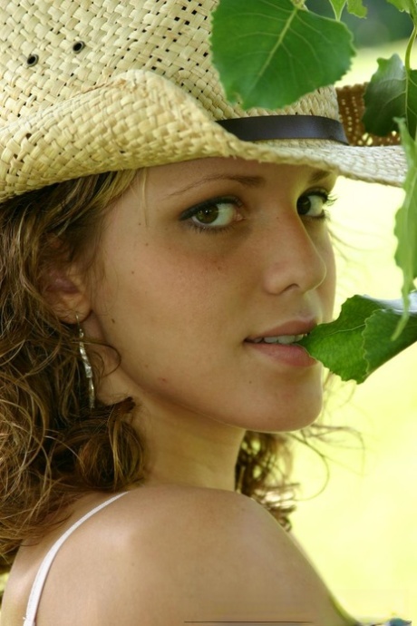 Teen amateur Karen lets denim skirt ride up to expose her underwear in yard