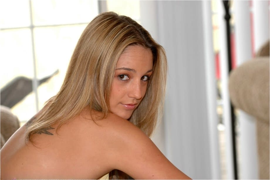 Blonde amateur Nikki Sims model non nude in a faded denim jeans