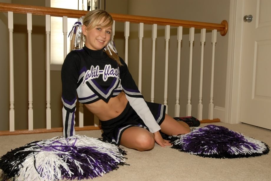 Adorable blonde teen Kasia exposes her big tits in cheerleader uniform
