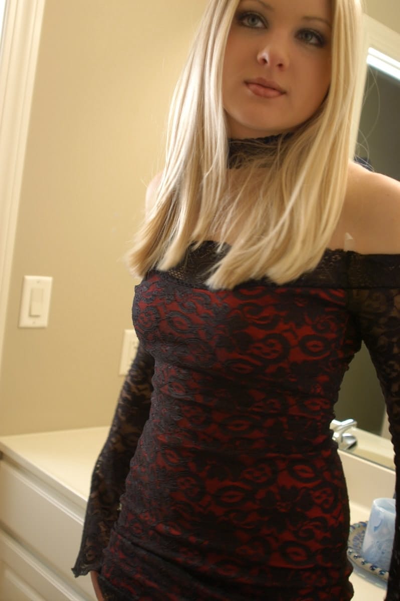 Hot teen with blonde hair poses productively while exposing upskirt thong