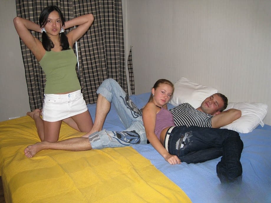 Young looking girls surprise man friend with an impromptu threesome