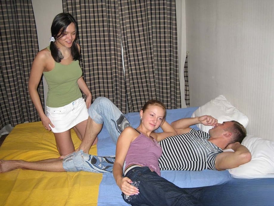 Young looking girls surprise man friend with an impromptu threesome