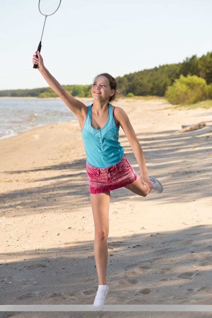 Sweet teen Faina Bona shows her butterfly labia lips after beach badminton