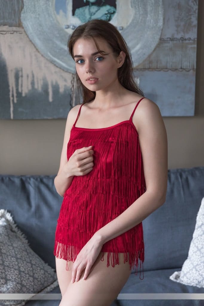 Nice teen Keira Blue uncovers her still budding boobs as she gets totally nude