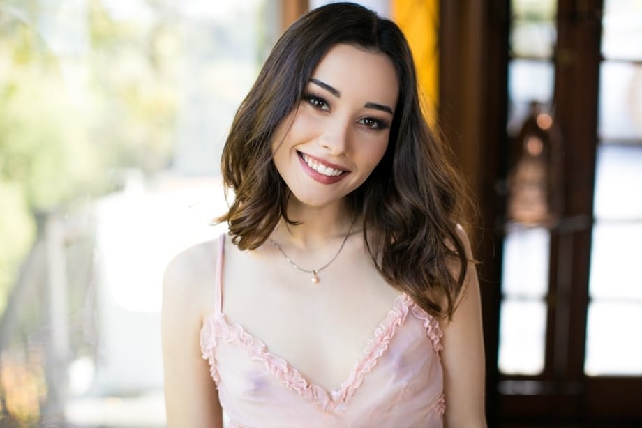 Brunette teen with a pretty face Aria Lee removes sheer lingerie to pose nude