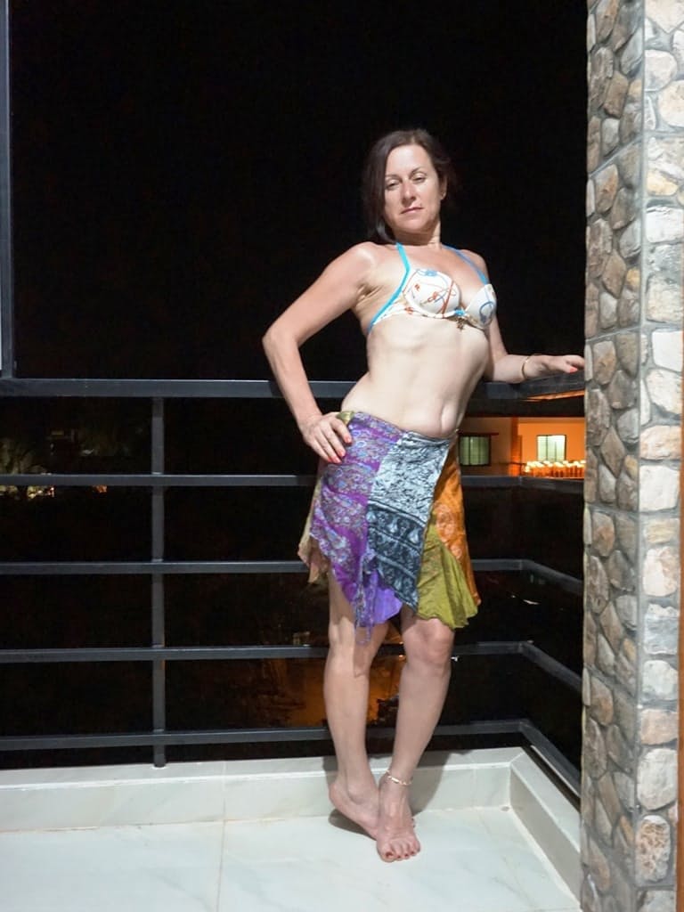 Mature woman Diana Ananta smokes a cigarette while exposing her snatch
