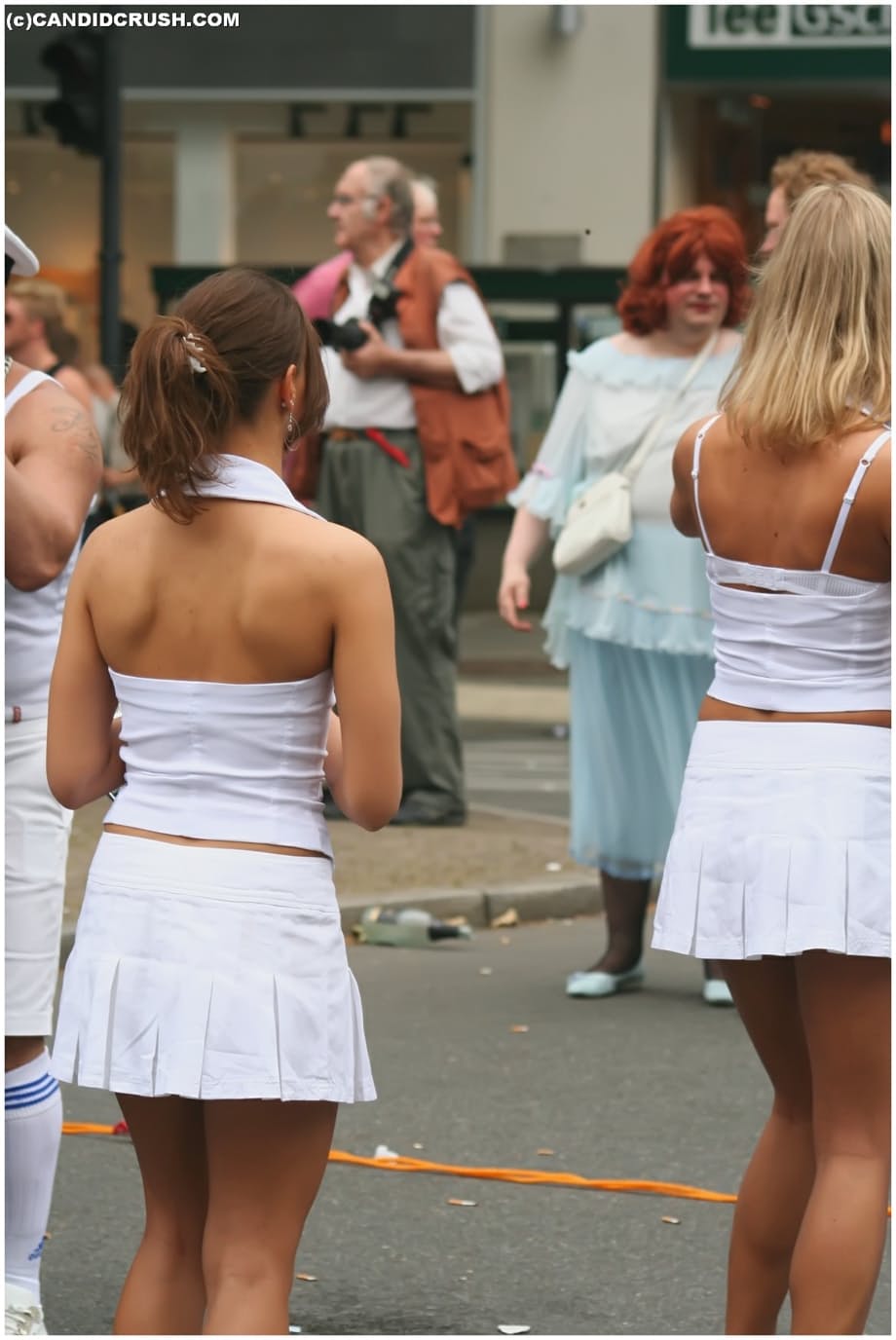 Teen girls at a street party are secretly recorded by a public voyeur