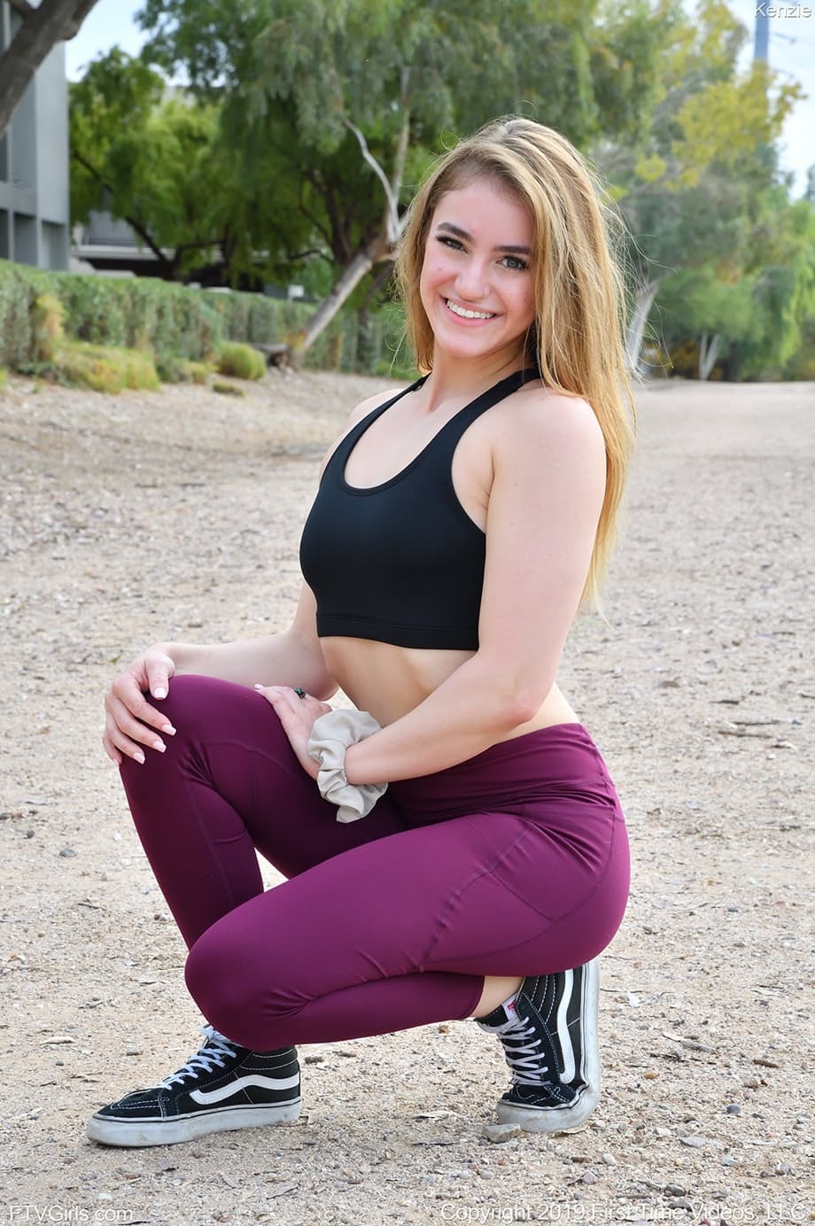 Amateur chick Kenzie slides leggings over her phat ass on paving stones